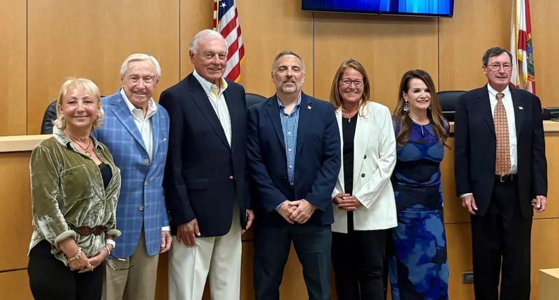 Marco Island City Council members standing together in the council chamber after voting to eliminate rodenticide use and adopt a poison-free rodent management program on January 5, 2026.
